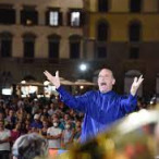 Luca Benucci conducting the Italian brass Ensemble in the Signoria square, July 28 2022